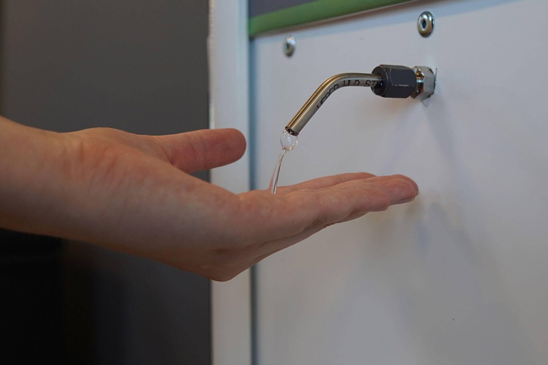 kleenstation-traffic-hand-sanitizer-station-in-use.jpg